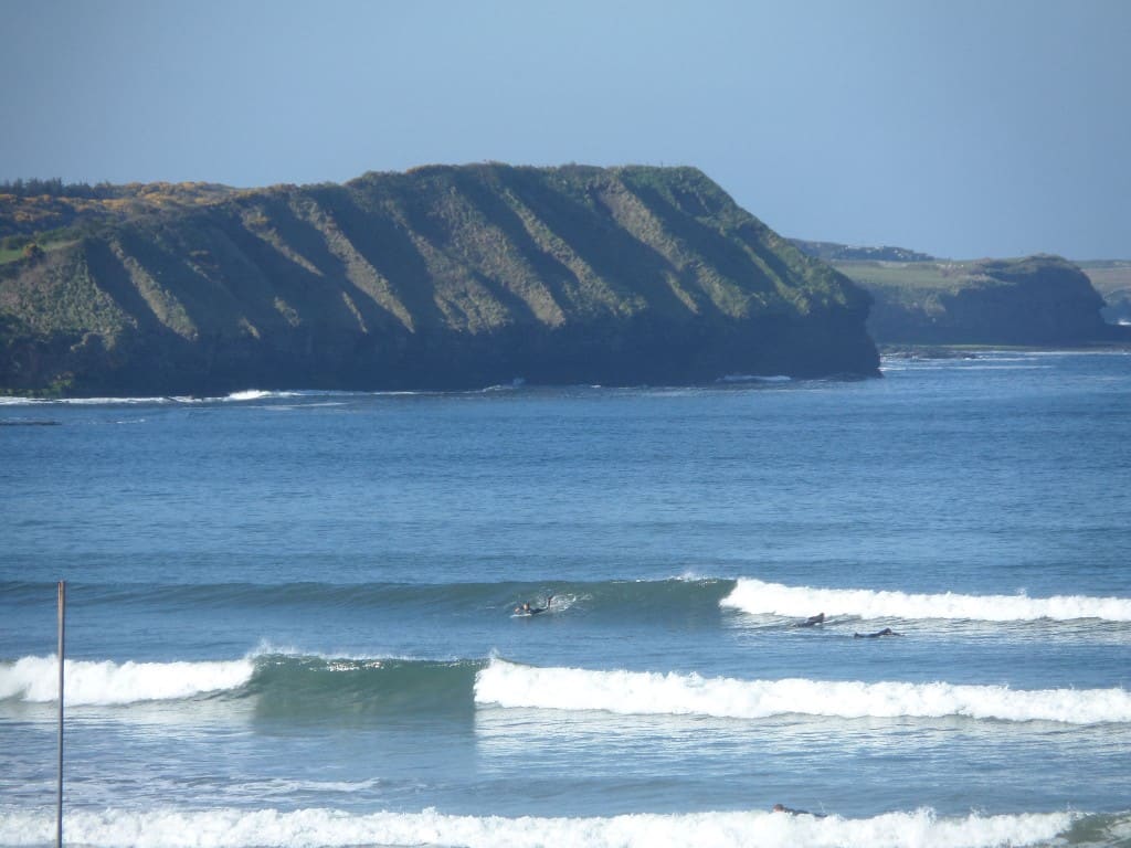 Surfers in the waves at Rossnowlagh Beach, Co. Donegal