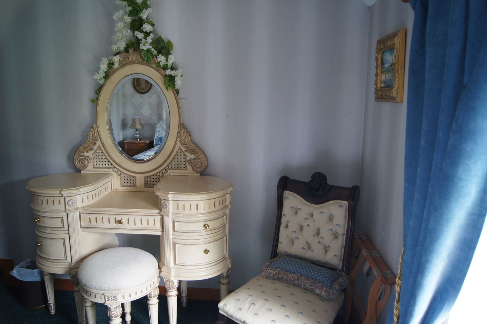 Family Ensuite vanity table with mirror, stool, and an upholstered chair